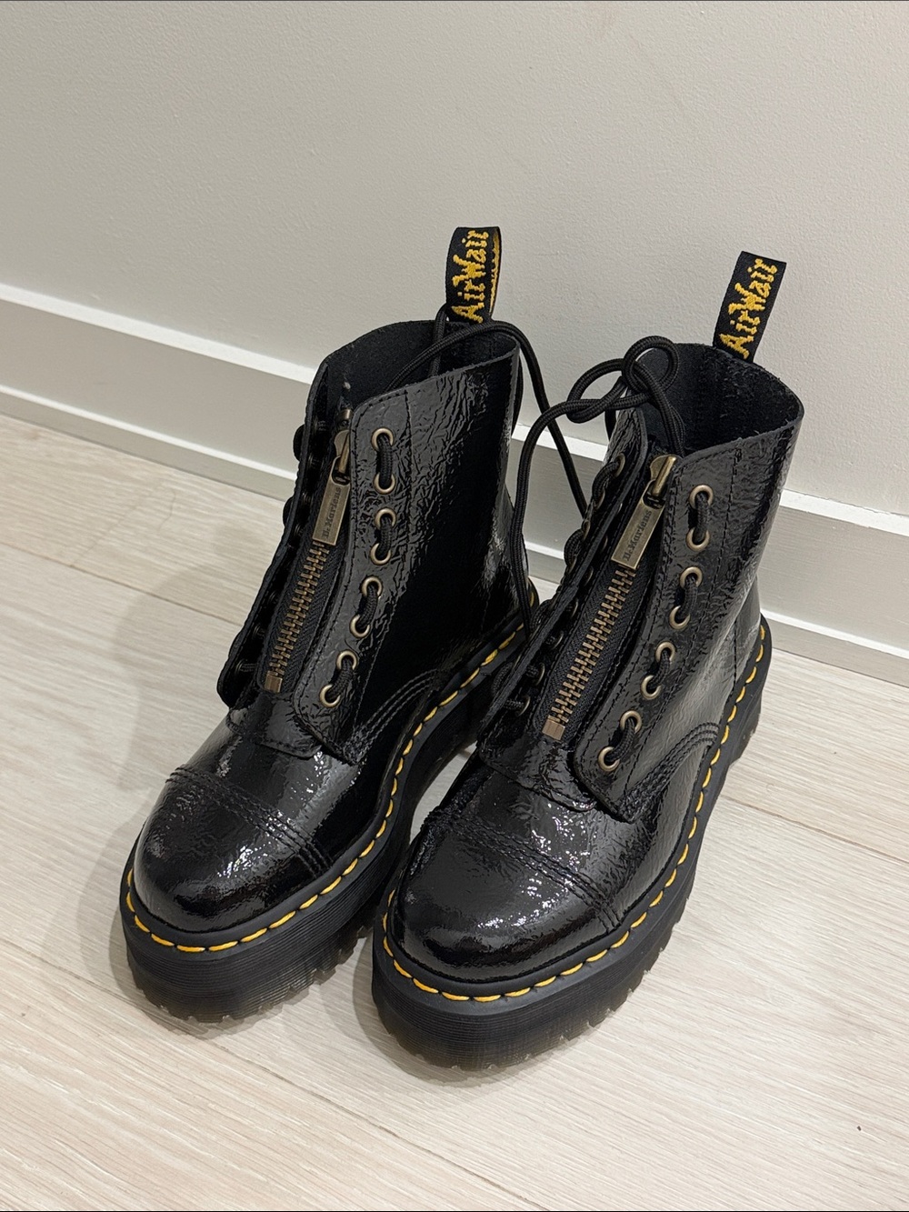 Dr. Martens Black Patent Platform Lace-Up Boots with Yellow Stitching